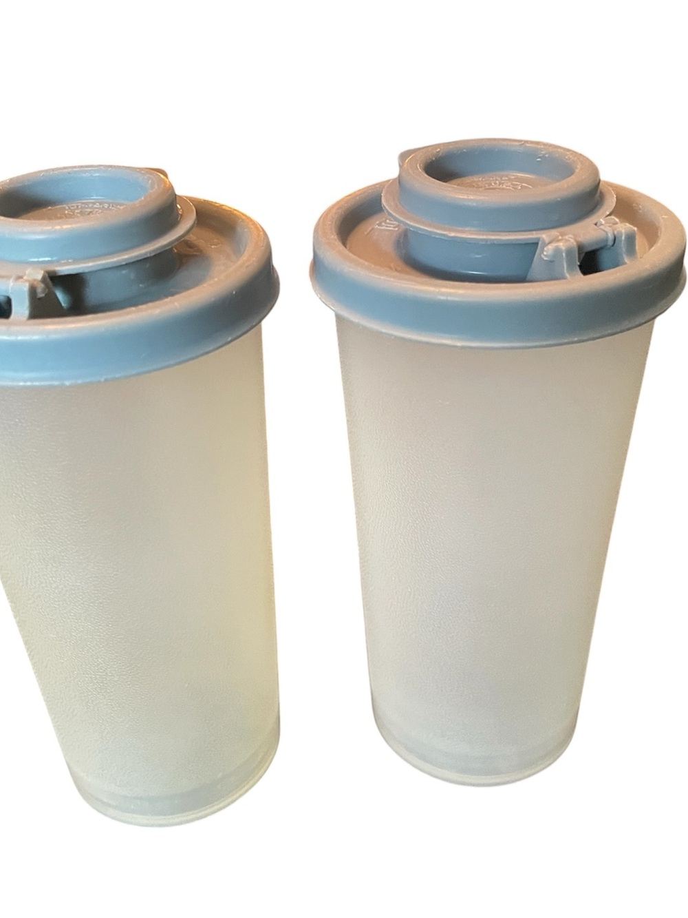 Tupperware Salt & Pepper Shakers clear w light blue covers 4.75” tall